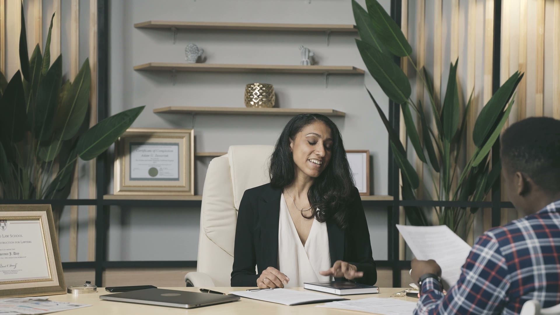 An adviser going through a client’s papers at her desk